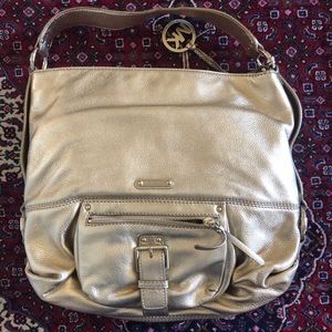 GOLD MICHAEL KORS PURSE IN NEW CONDITION